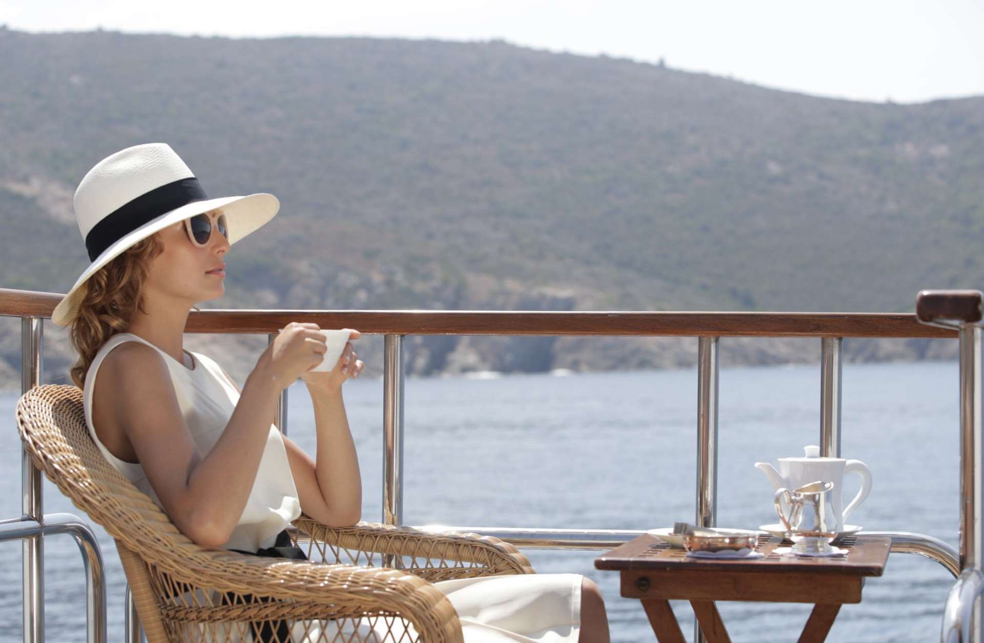 Lady enjoying tea at sea