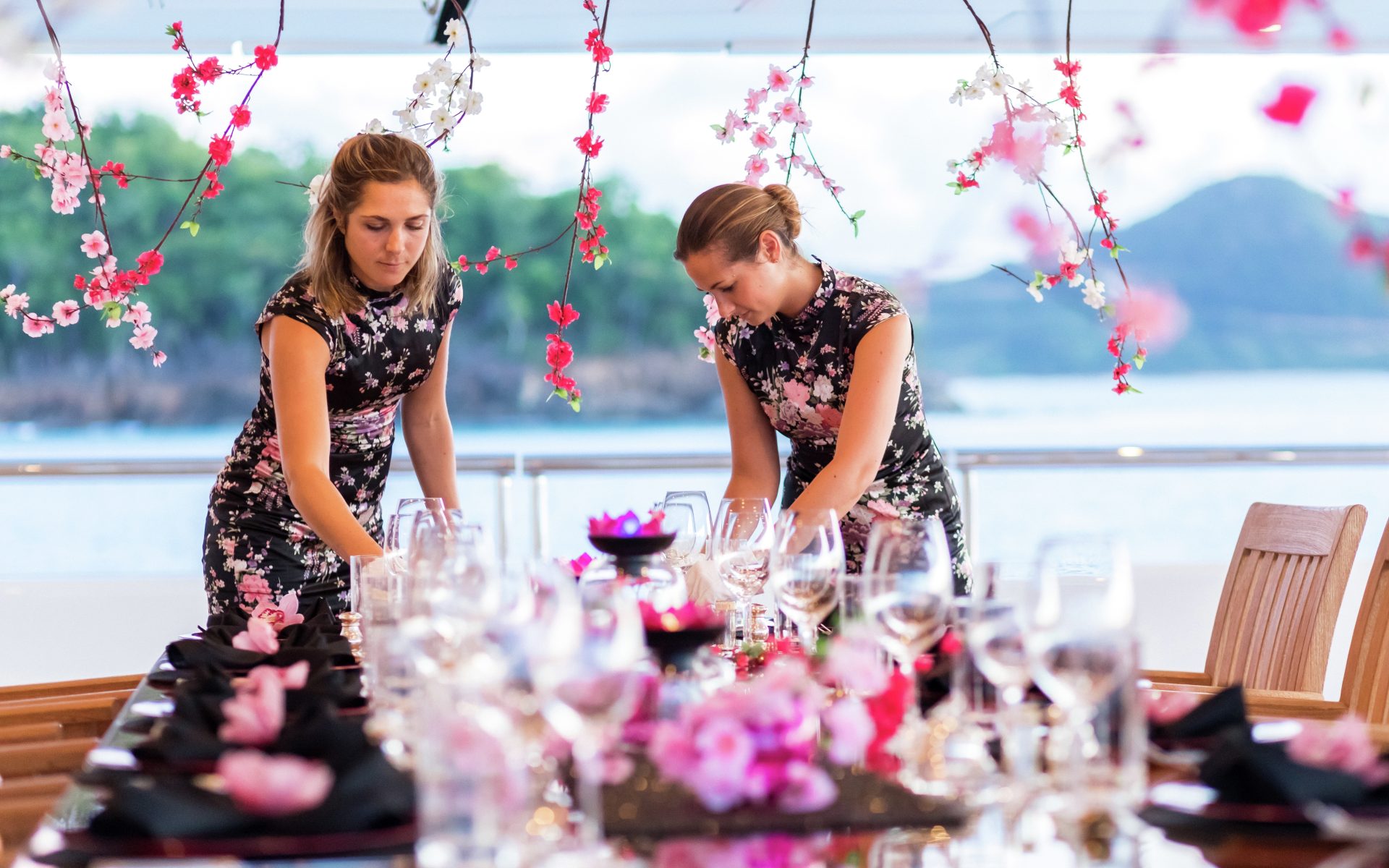 Superyacht staff laying table settings