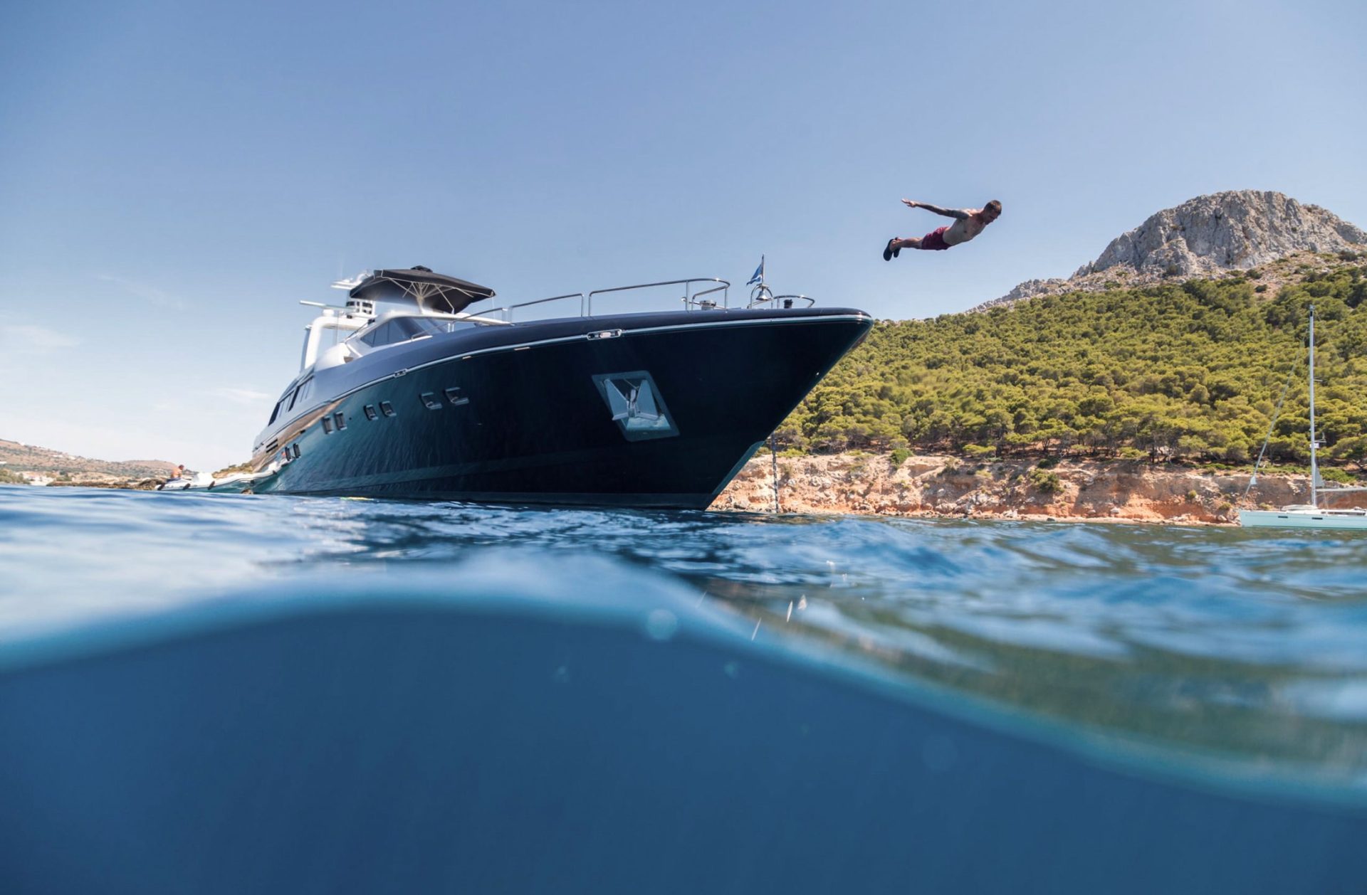 Man diving from superyacht