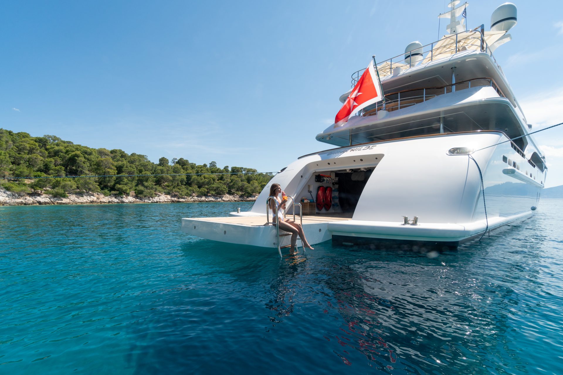 Lady sitting at the back of superyacht