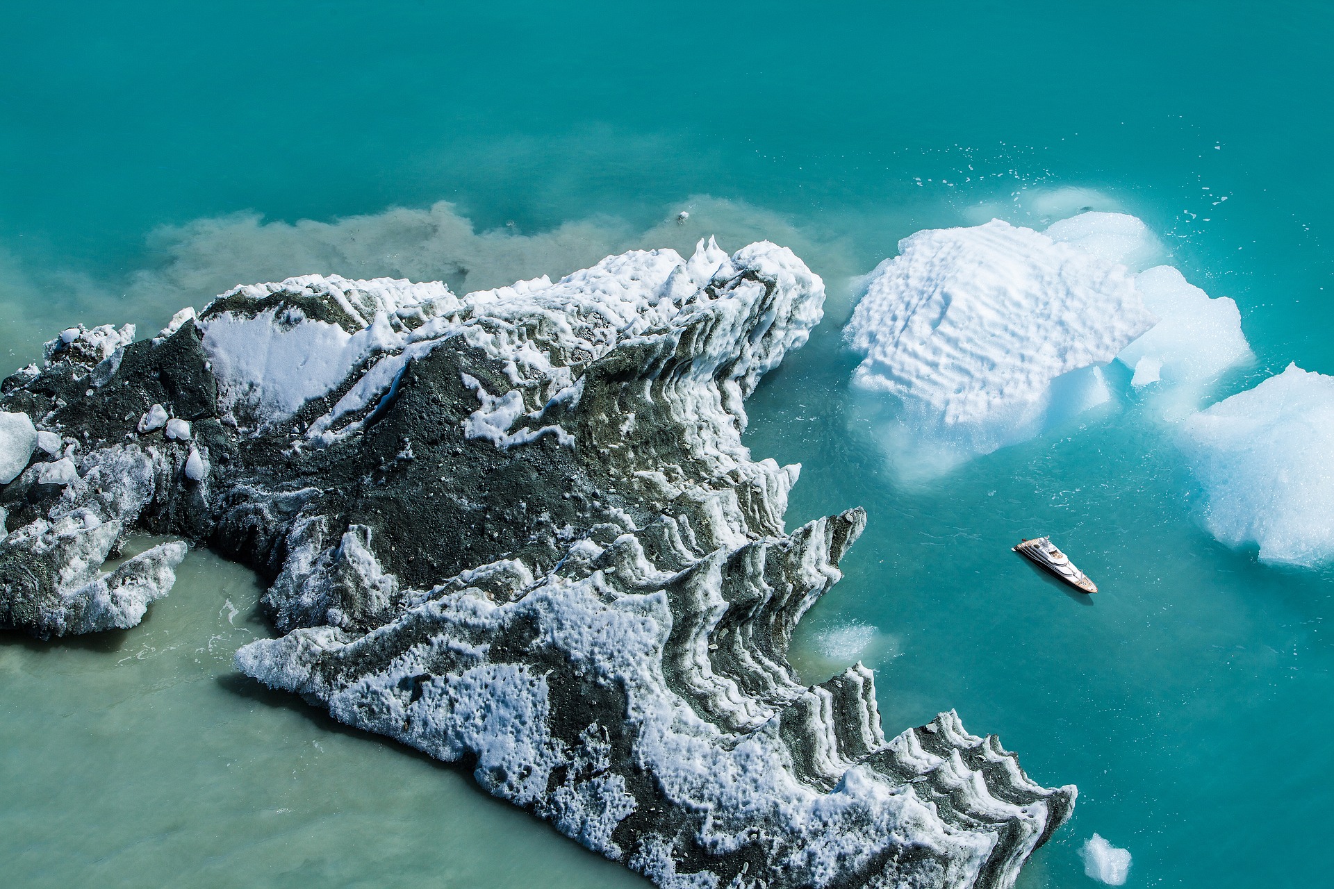 Superyacht from above with wintery landscape